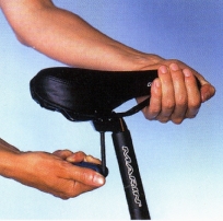 Move your saddle back if the depression on your leg is in front of the axle. If it is behind, move it forward. 