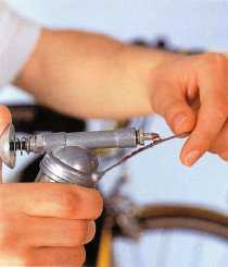 Smear grease on all new cables and, occasionally, on old ones. Place a blob of grease on the nipple end of the cable, then
pull the cable through your thumb and index finger before fitting it.
Wear mechanic’s disposable gloves.